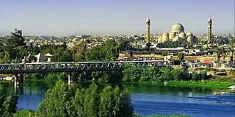 The Old Bridge of Mosul, with the Mosul Grand Mosque in the background