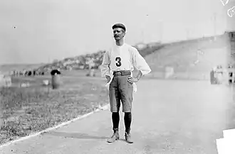 Black and white photograph of Carvajal in his cut-off trousers and street shoes.