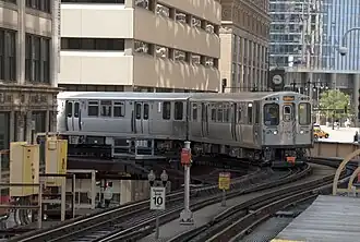A Pink Line train approaching Randolph/Wabash station