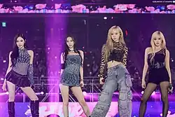 Image of Aespa members posing on a stage