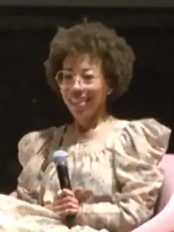 Photo of Sherald wearing a dress