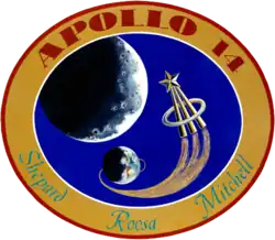 The circular patch depits the Earth and the Moon. An astronaut lapel pin leaves a comet trail from the liftoff point on Earth. Around it is the logo "Apollo 14 – Shepard Roosa Mitchell"