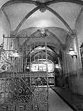 Vaulted driveway leading into the courtyard