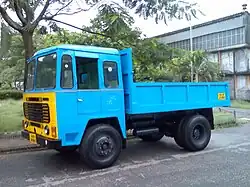 An Ashok Leyland Comet dump truck, an example of a very basic 4×2 dump truck used for payloads of 10 metric tons (11.0 short tons; 9.8 long tons) or less