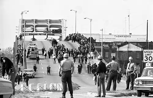 Police get ready to attack marchers crossing the Edmund Pettus Bridge