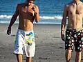 Two men wearing boardshorts
