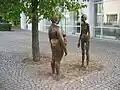 The sculpture The women of bronze outside of the art museum, Växjö. The sculpture is a work by Marianne Lindberg De Geer. It shows two women, one anorexic, and the other obese. Since it was placed there in 2006, the sculpture has been controversial. Both statues have been vandalized and repaired during 2006. They are starting to become a tourist attraction, in part due to the conflict.