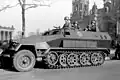 A half-track (vehicle); The picture shows a front wheel, and a track (farther to the right side of the picture).