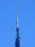 The spire is added along with the TV/radio mast.
