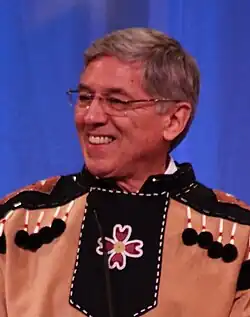 Mallott smiling, wearing native Tlingit dress