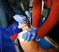 CPR being performed on a medical-training dummy. Image: CPR training image #04
