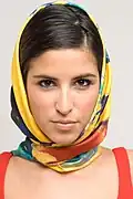 New York fashion model wearing a square silk Foulard type scarf by French designer Casol.