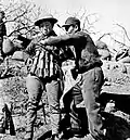 Chinese suicide bomber putting on an explosive vest made out of Model 24 hand grenades to use in an attack on Japanese tanks at the Battle of Taierzhuang&nbsp;[en] in 1938.