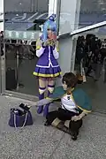 2 people cosplaying as Aqua and Kazuma, 2 of the main characters in the series.