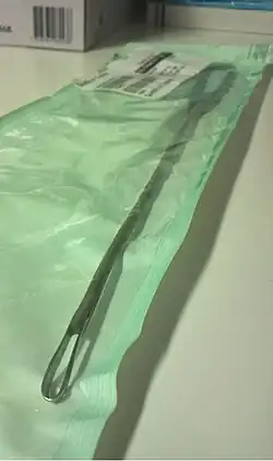 Curette in sterile pouch.
