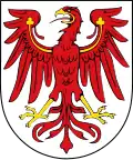 Argent, an eagle displayed gules armed and wings charged with trefoils Or. Arms of Brandenburg.