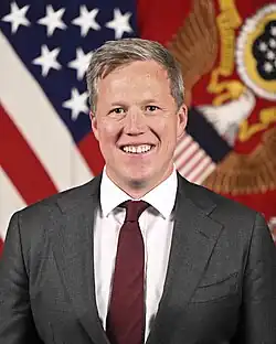 Headshot of Driscoll in a suit