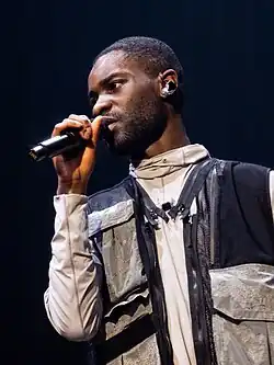 Dave performing in 2019