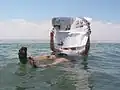 Reading a newspaper while floating in the Dead Sea