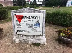 Red triangle on a historical marker for Sachsenhausen death march victims