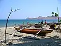 Canoes on shore at Dili  The attorney general’s office in East Timor