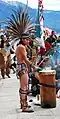 A modern Aztec drumming in traditional Aztec clothing