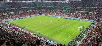  Photo showing the inside of the Education City Stadium in Qatar. This was one of many stadiums constructed by migrant workers under the Kafala system