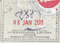 An arrival stamp issued by the Immigration Officer of the airport on 8 January 2011.