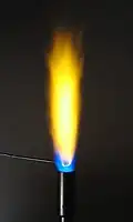Flame test for sodium. The yellow color is very bright and common.