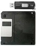 A 3.5&nbsp;inch floppy disk, vs. an USB flash drive. The small drive has over 10.000 times the capacity of the large one.