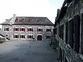 Store room and powder magazine; soldiers' barracks at right