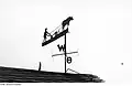 farmer plowing weather vane