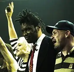 Gabrial McNair (center) next to Gwen Stefani (left) on the Harajuku Lovers Tour