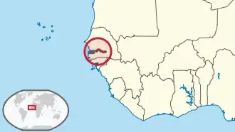 Location of the Gambia (dark red area within circle) on the coast of West Africa.
