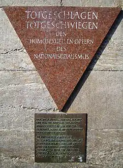 This pink triangle plaque in the Berlin Nollendorfplatz subway station honors gay male victims