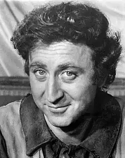 A black-and-white photo of Wilder smiling