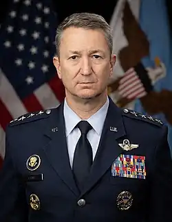 A man in a suit staring forward