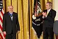 Former Prime Minister of Australia John Howard receiving the Medal from George W. Bush on January 13, 2009