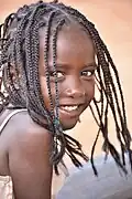 Ethiopian girl with her hair in braids.