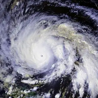 A view of Hurricane Gloria from Space on September 25. The intense storm features a small eye and large convective bands.
