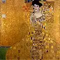 The works of  Gustav Klimt, the Austrian painter, are an example of the influence of graphic design on painting. This portrait of Adele Bloch-Bauer shows many of the influences of the graphic design of those times.