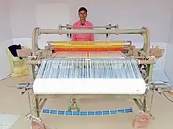 Weaver from India showing handloom during an exhibition