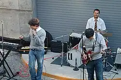 Photograph of a group playing instruments in an amphitheater.