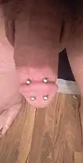 Double dydoe piercings (through the corona)