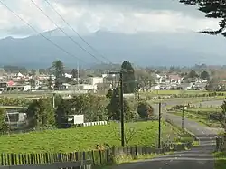 A view of Inglewood from Lincoln Road, with Mount Taranaki in the background, hidden by cloud