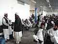 Men wearing shalwar kameez at Kabul Airport in Afghanistan.