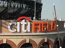 Citi Field logo being installed on the stadium