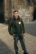 An Israeli Border Police soldier in a fir colared blouson.