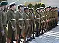 IDF female Military Police wearing skirts with their White caps and belts