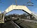 Footbridge over a railway line, at a railway station in Glasgow